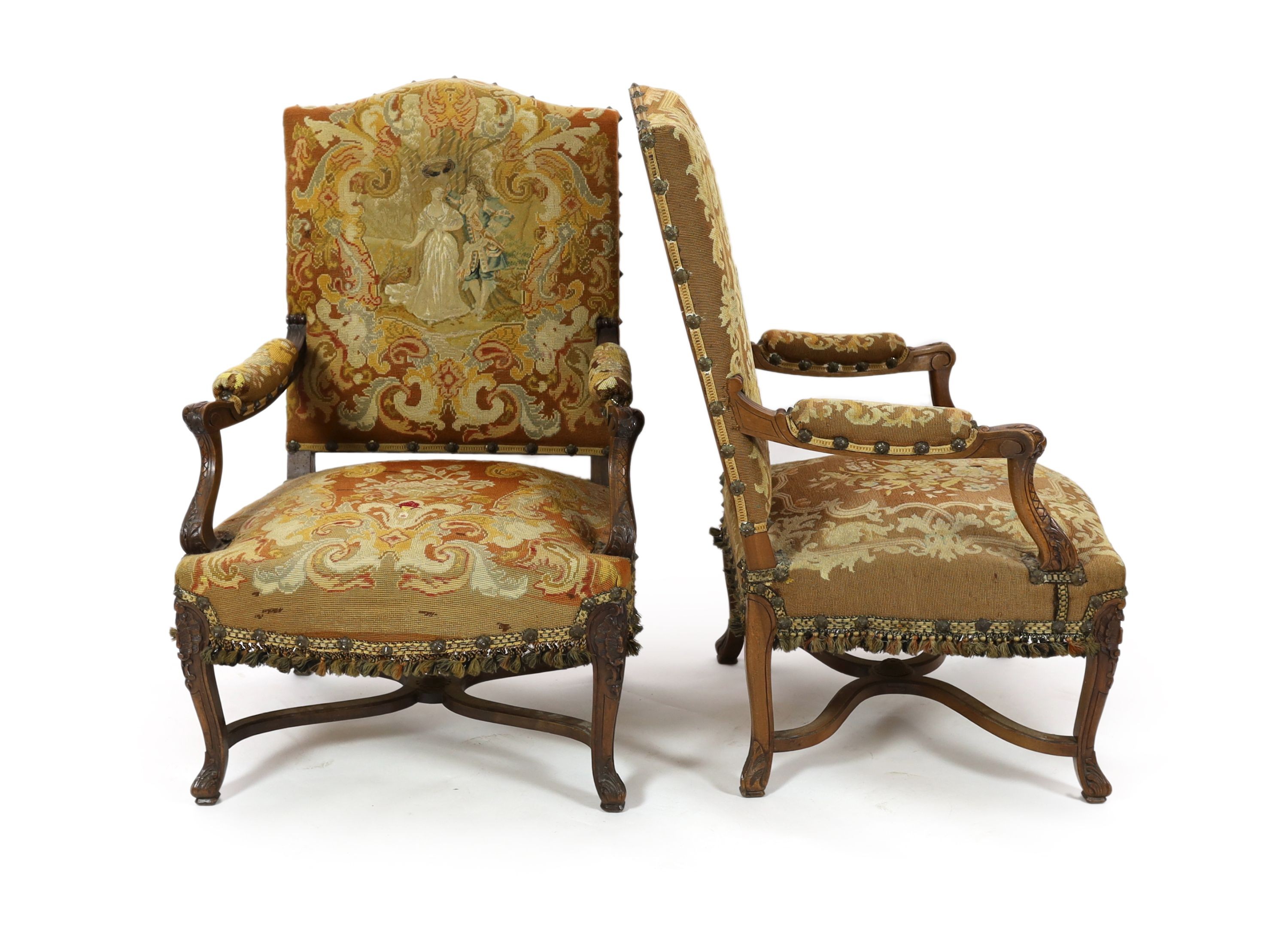 A pair of 19th century French walnut fauteuils W. 75cm. D. 78cm. H. 112cm.